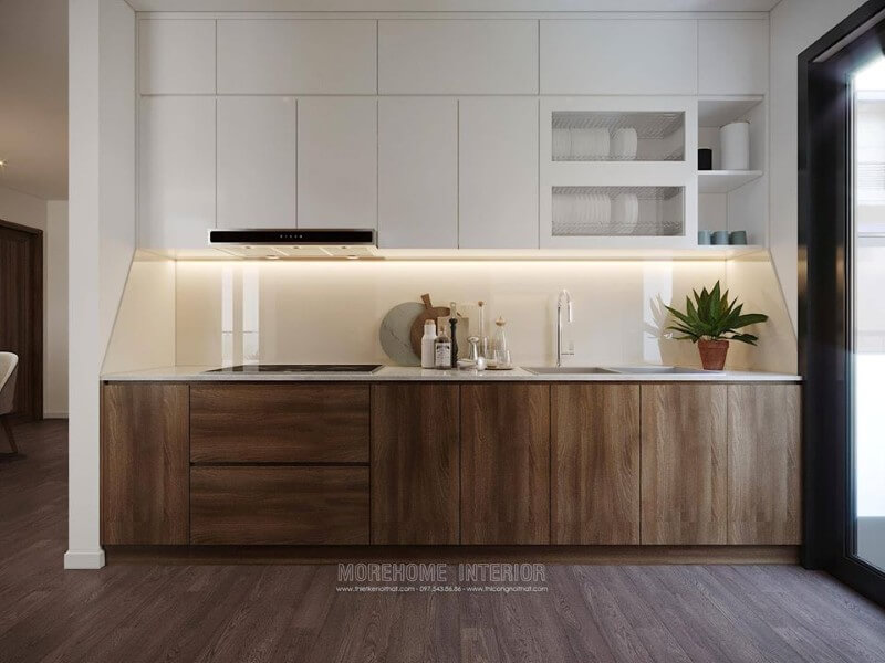 Tủ bếp dưới được làm từ gỗ công nghiệp, màu nâu trầm sang trọng, ngăn tủ cỡ lớn tạo sự thuận tiện cho việc cất, chứa đồ đạc của người nội trợ. Thiết kế nhà bếp đẹp