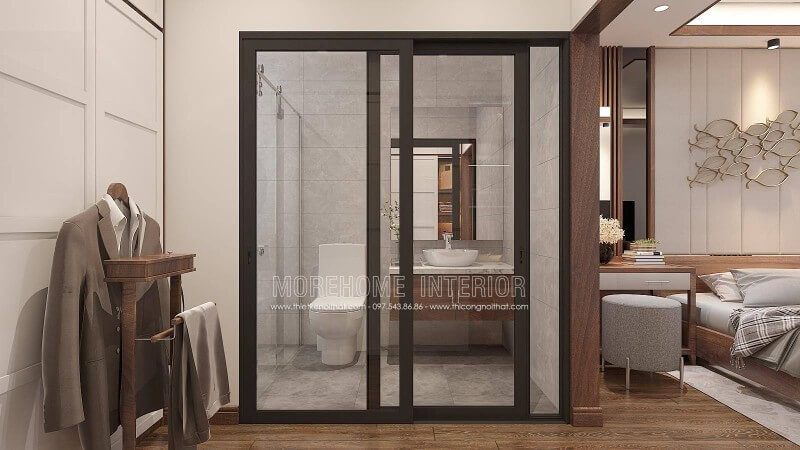 Bạn đang băn khoăn với ý tưởng bố trí phòng ngủ nam khép kín khi sử dụng gỗ óc chó làm vật liệu chủ đạo phòng ngủ thì phòng tắm nên trang trí như nào cho hợp lý mà vẫn giữ nguyên vẻ đẹp sang trọng đó. Ý tưởng trang trí phòng tắm cửa kính trượt viền đen kết hợp không gian màu xám từ gạch ốp giả bê tông cùng tủ đựng đồ phòng tắm bề mặt đá vân mây với lớp cánh gỗ óc chó sẽ là gợi ý khá độc đáo trong căn hộ chung cư, nhà phố, nhà liền kề, biệt thự.